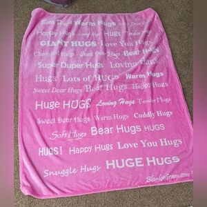 BlankieGram "Hugs" plush throw blanket in pink microfiber polyester material. 
